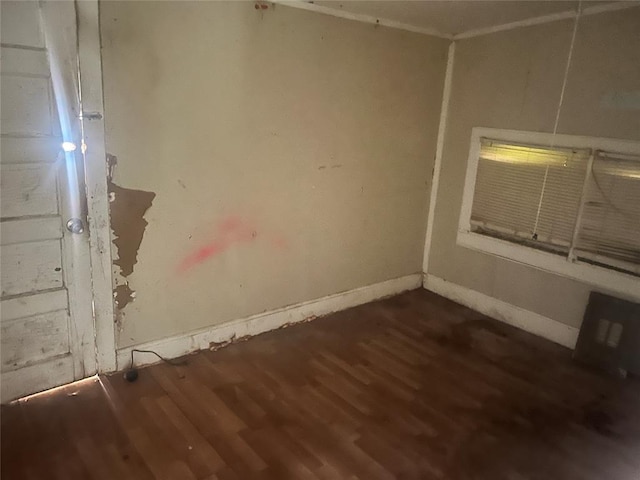 307 W Walnut Ave, Seminole, OK 74868 - spare room featuring dark wood-style flooring