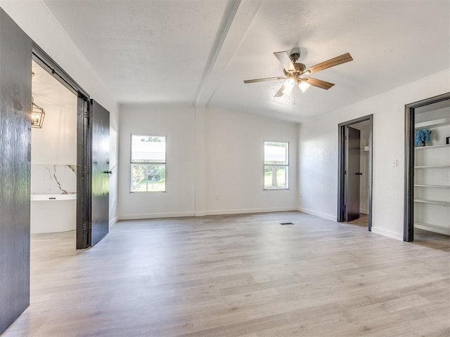 9200 Hollow Rd, Newalla, OK 74857 - unfurnished bedroom featuring multiple windows, light wood-type flooring, and ceiling fan