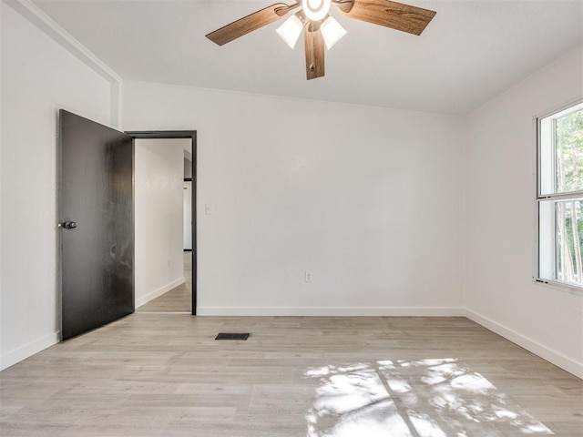 9200 Hollow Rd, Newalla, OK 74857 - empty room featuring a ceiling fan and light wood-style floors