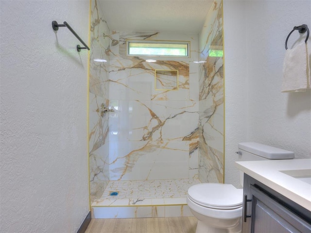 9200 Hollow Rd, Newalla, OK 74857 - bathroom with a textured wall, vanity, a marble finish shower, and wood finished floors