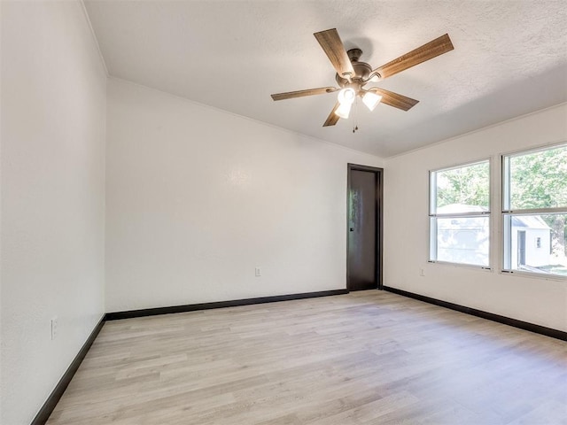 9200 Hollow Rd, Newalla, OK 74857 - unfurnished room featuring light wood finished floors and a ceiling fan