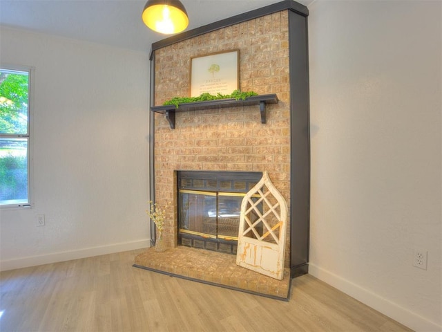 9200 Hollow Rd, Newalla, OK 74857 - detailed view of wood finished floors and a brick fireplace