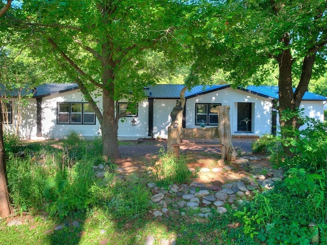 9200 Hollow Rd, Newalla, OK 74857 - single story home featuring a metal roof and a standing seam roof