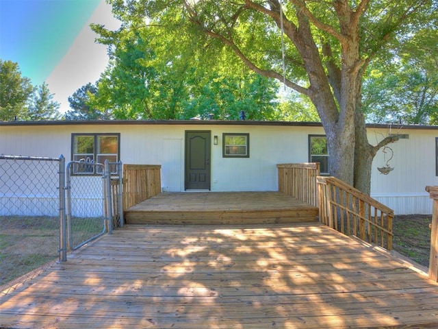 9200 Hollow Rd, Newalla, OK 74857 - view of front facade with a wooden deck and a gate