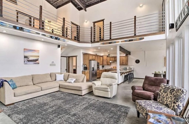 115008 S 4292nd Rd, Porum, OK 74455 - living area featuring concrete floors and a towering ceiling