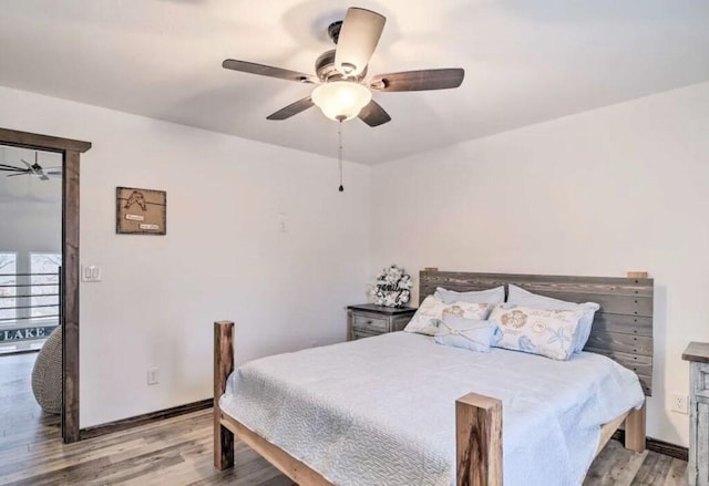115008 S 4292nd Rd, Porum, OK 74455 - bedroom with light wood-style flooring and ceiling fan