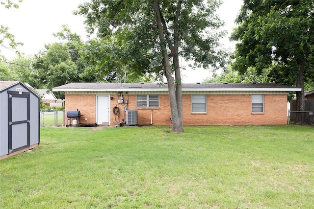 1702 W Boyd St, Norman, OK 73069 - back of house with brick siding and a storage unit