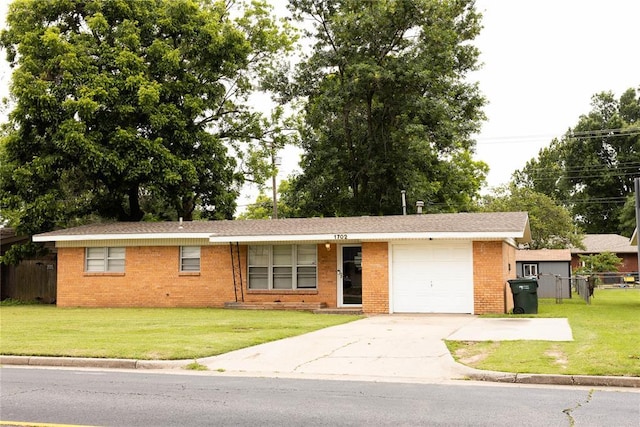 1702 W Boyd St, Norman, OK 73069 - ranch-style house with an attached garage, brick siding, and driveway