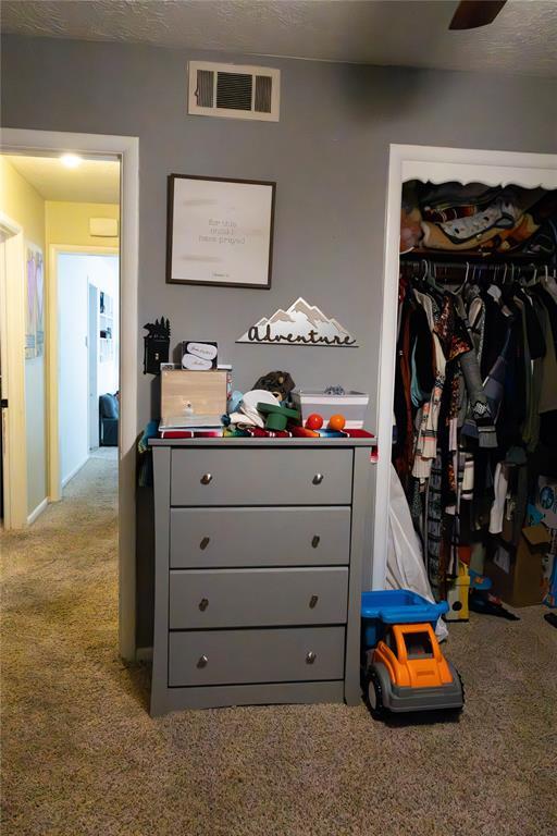 1702 W Boyd St, Norman, OK 73069 - carpeted bedroom featuring a closet