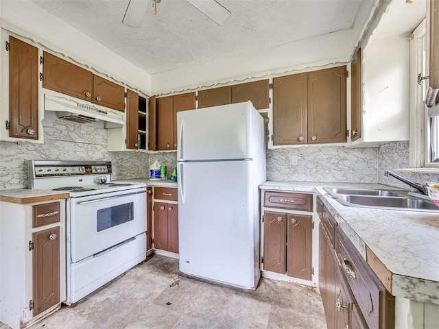 9424 NE 28th St, Oklahoma City, OK 73141 - kitchen with white appliances, under cabinet range hood, backsplash, a textured ceiling, and light countertops