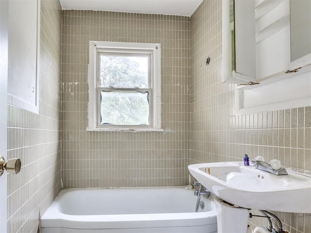 9424 NE 28th St, Oklahoma City, OK 73141 - bathroom featuring tile walls and a sink