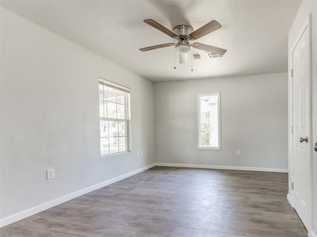 321 W Farrall Ave, Shawnee, OK 74801 - spare room with plenty of natural light, wood finished floors, and a ceiling fan