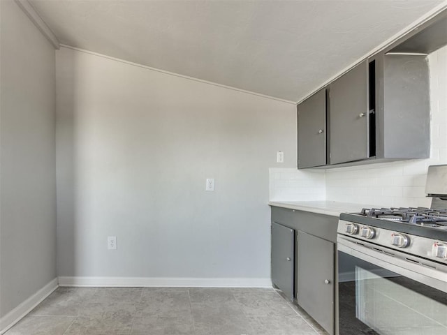 321 W Farrall Ave, Shawnee, OK 74801 - kitchen with stainless steel gas stove, gray cabinets, backsplash, and light countertops
