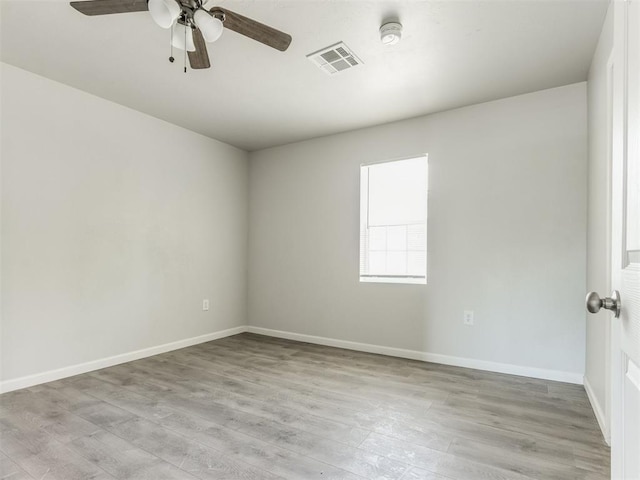 321 W Farrall Ave, Shawnee, OK 74801 - spare room with a smoke detector, light wood finished floors, and ceiling fan