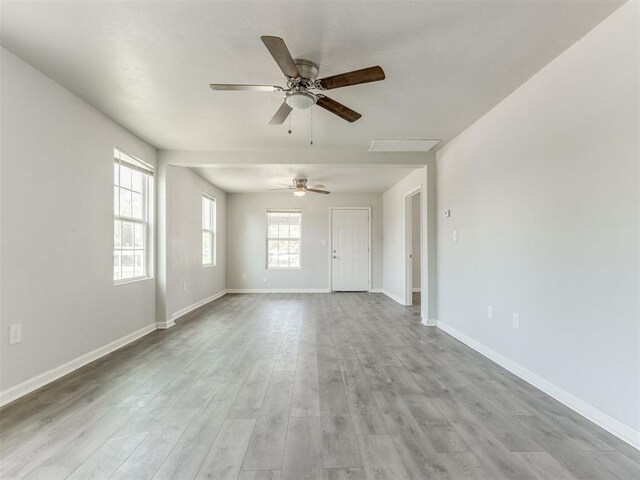 321 W Farrall Ave, Shawnee, OK 74801 - unfurnished living room featuring ceiling fan and wood finished floors