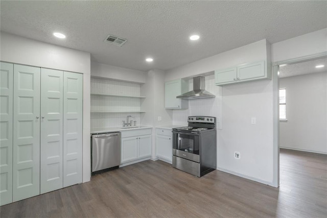 4720 S Youngs Blvd, Oklahoma City, OK 73119 - kitchen with stainless steel appliances, wall chimney range hood, open shelves, dark wood-style flooring, and a textured ceiling