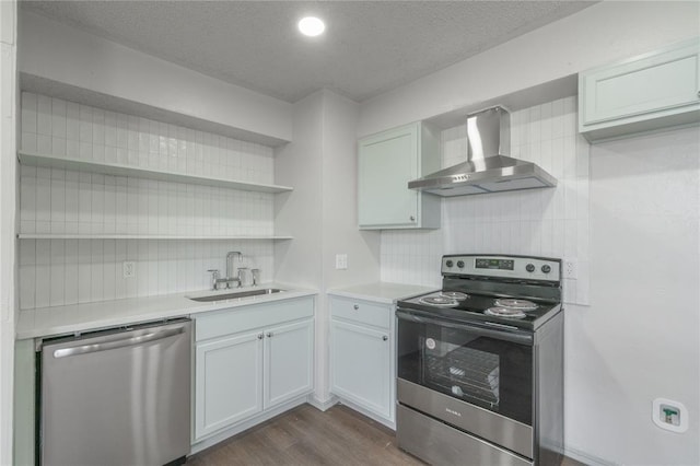 4720 S Youngs Blvd, Oklahoma City, OK 73119 - kitchen with stainless steel appliances, wall chimney exhaust hood, open shelves, tasteful backsplash, and light countertops