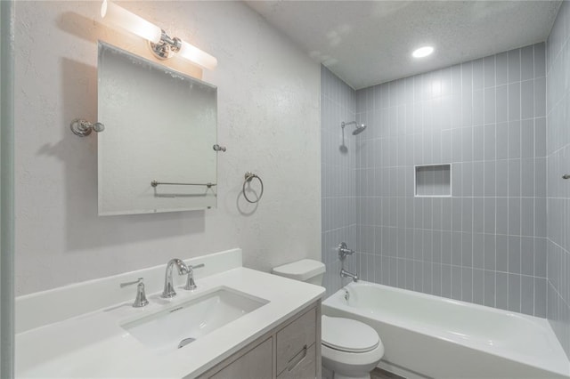 4720 S Youngs Blvd, Oklahoma City, OK 73119 - bathroom with washtub / shower combination, vanity, a textured wall, and recessed lighting
