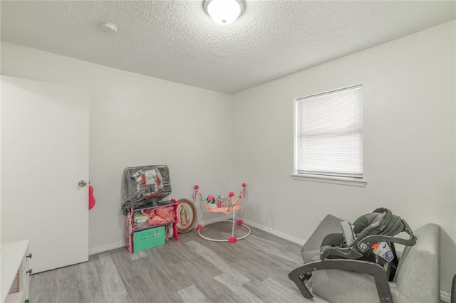 4720 S Youngs Blvd, Oklahoma City, OK 73119 - rec room featuring wood finished floors and a textured ceiling