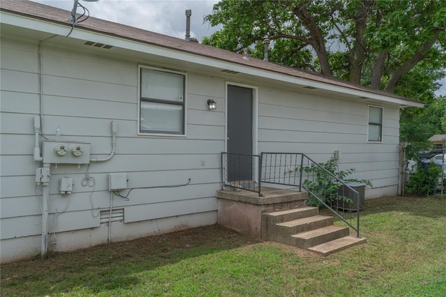 4720 S Youngs Blvd, Oklahoma City, OK 73119 - property entrance with a lawn