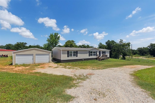 4040 Logan Hills Dr, Guthrie, OK 73044 - manufactured / mobile home featuring a garage, an outdoor structure, and a front lawn