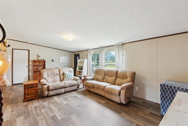 4040 Logan Hills Dr, Guthrie, OK 73044 - living area featuring light wood-type flooring, crown molding, and vaulted ceiling