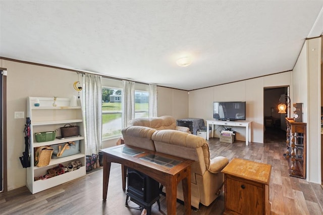 4040 Logan Hills Dr, Guthrie, OK 73044 - living room featuring wood finished floors, lofted ceiling, crown molding, and a textured ceiling