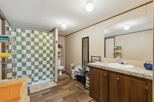 4040 Logan Hills Dr, Guthrie, OK 73044 - full bathroom with vanity, tiled shower, and wood finished floors