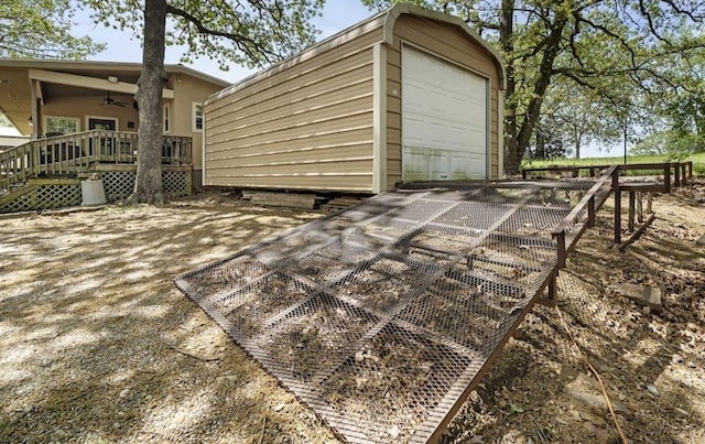 273 N Elm St Unit 1, Eufaula, OK 74432 - view of patio / terrace featuring a ceiling fan, an outdoor structure, and a garage