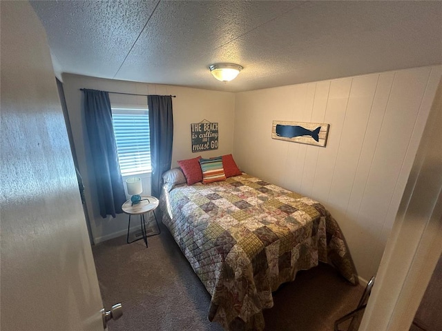273 N Elm St Unit 1, Eufaula, OK 74432 - carpeted bedroom with a textured ceiling and baseboards