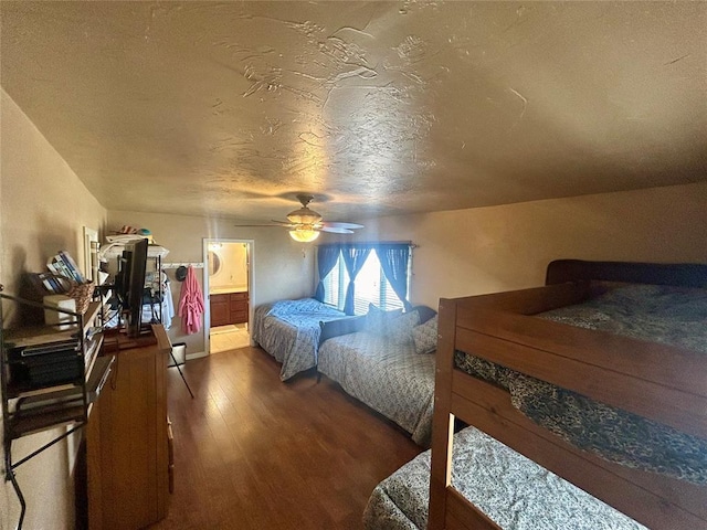273 N Elm St Unit 1, Eufaula, OK 74432 - bedroom with wood finished floors, a textured ceiling, ensuite bathroom, and ceiling fan