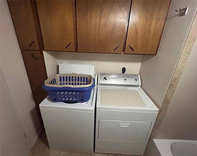 273 N Elm St Unit 1, Eufaula, OK 74432 - laundry room featuring washing machine and clothes dryer and cabinet space