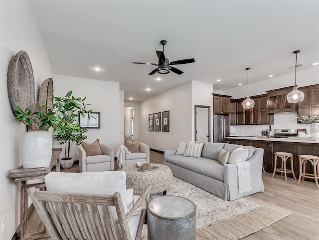 2436 NW 179th St, Edmond, OK 73012 - living room featuring ceiling fan, light wood-style flooring, and recessed lighting
