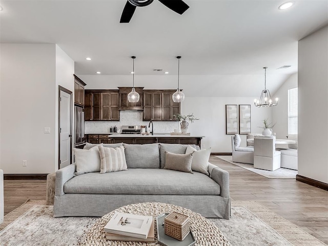 2436 NW 179th St, Edmond, OK 73012 - living area featuring recessed lighting, a ceiling fan, light wood-style flooring, and a chandelier