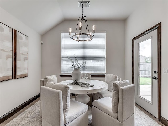 2436 NW 179th St, Edmond, OK 73012 - dining area with a chandelier, light wood finished floors, healthy amount of natural light, and lofted ceiling
