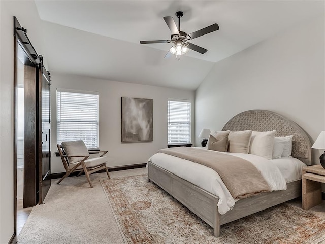 2436 NW 179th St, Edmond, OK 73012 - bedroom with light colored carpet, lofted ceiling, a barn door, and ceiling fan