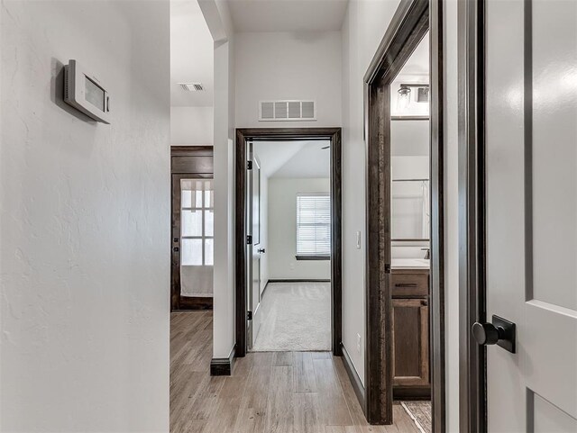 2436 NW 179th St, Edmond, OK 73012 - hall featuring light wood-style floors and baseboards