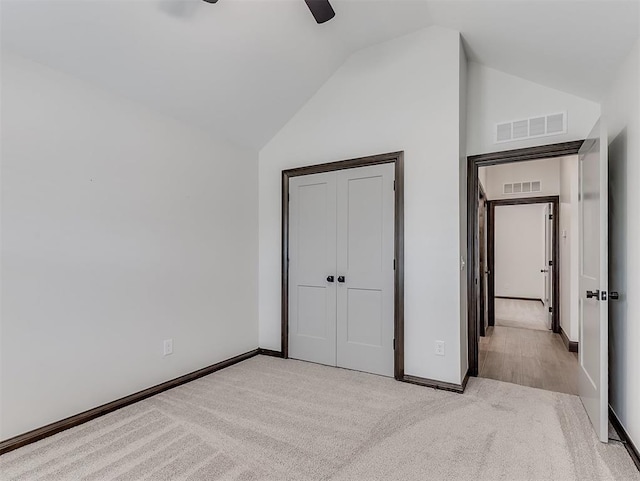 2436 NW 179th St, Edmond, OK 73012 - unfurnished bedroom with lofted ceiling, carpet, a closet, and a ceiling fan
