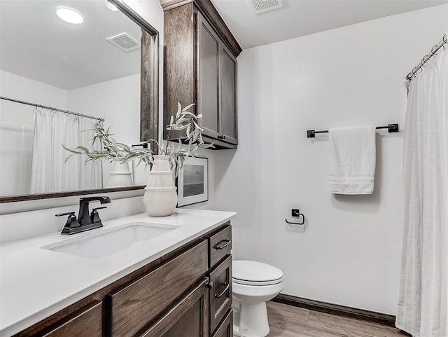 2436 NW 179th St, Edmond, OK 73012 - bathroom featuring vanity, wood finished floors, and a shower with curtain