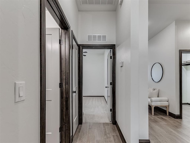 2436 NW 179th St, Edmond, OK 73012 - hallway with light wood-style floors and baseboards