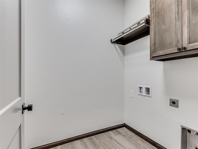 2436 NW 179th St, Edmond, OK 73012 - washroom featuring hookup for an electric dryer, washer hookup, light wood finished floors, and cabinet space
