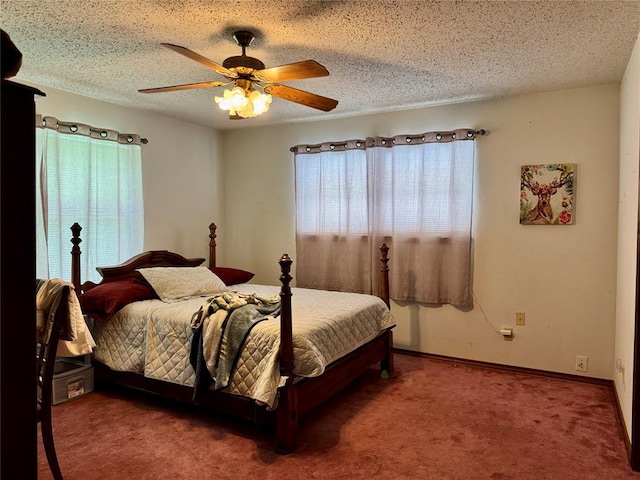 311 Parker St, Waurika, OK 73573 - carpeted bedroom with a ceiling fan and baseboards