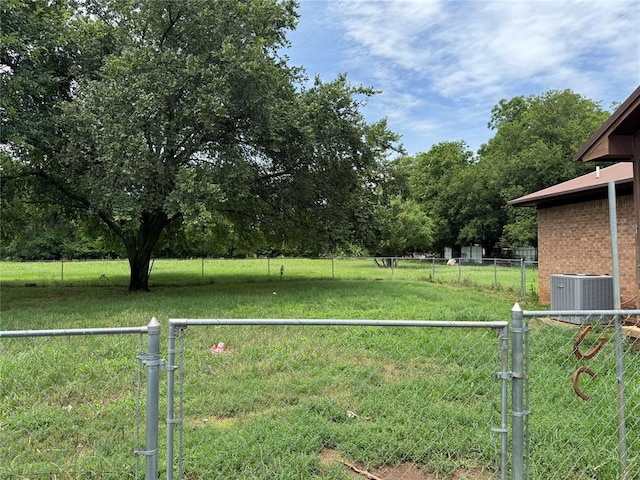 311 Parker St, Waurika, OK 73573 - view of yard with a gate and a view of countryside