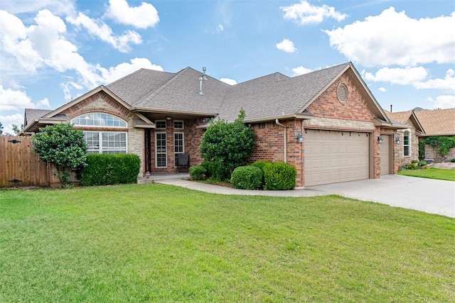 716 SW 157th St, Oklahoma City, OK 73170 - view of front of home with a garage, a shingled roof, driveway, and brick siding