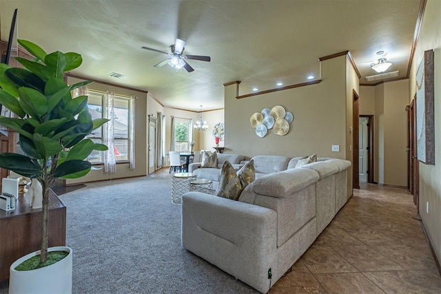 716 SW 157th St, Oklahoma City, OK 73170 - living room with crown molding, ceiling fan, and a chandelier