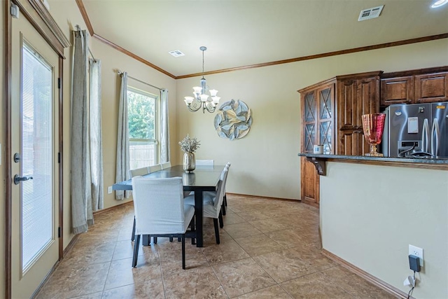 716 SW 157th St, Oklahoma City, OK 73170 - dining space with a chandelier and crown molding