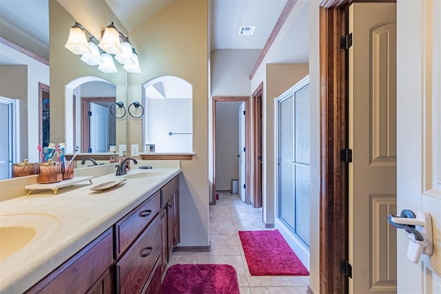 716 SW 157th St, Oklahoma City, OK 73170 - full bath featuring double vanity, tile patterned floors, a stall shower, a chandelier, and lofted ceiling