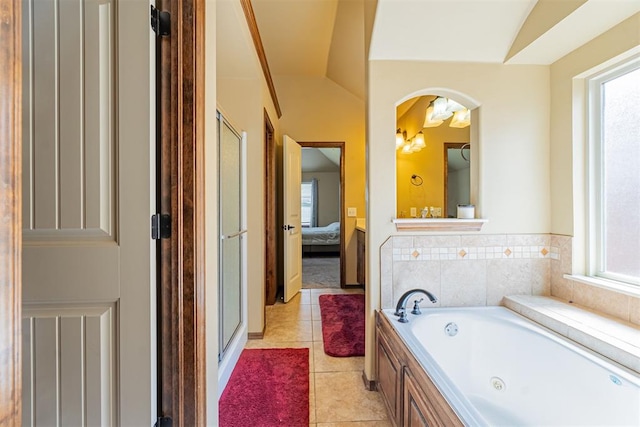 716 SW 157th St, Oklahoma City, OK 73170 - ensuite bathroom featuring plenty of natural light, a jetted tub, a shower stall, and tile patterned floors