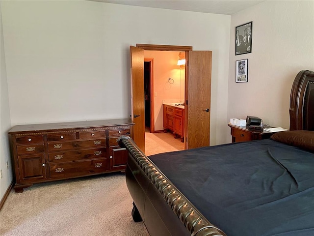 8905 Ava Ave, Oklahoma City, OK 73149 - bedroom with light colored carpet and connected bathroom