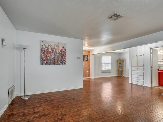 1209 Dakota St, Norman, OK 73069 - unfurnished living room featuring wood-type flooring and baseboards
